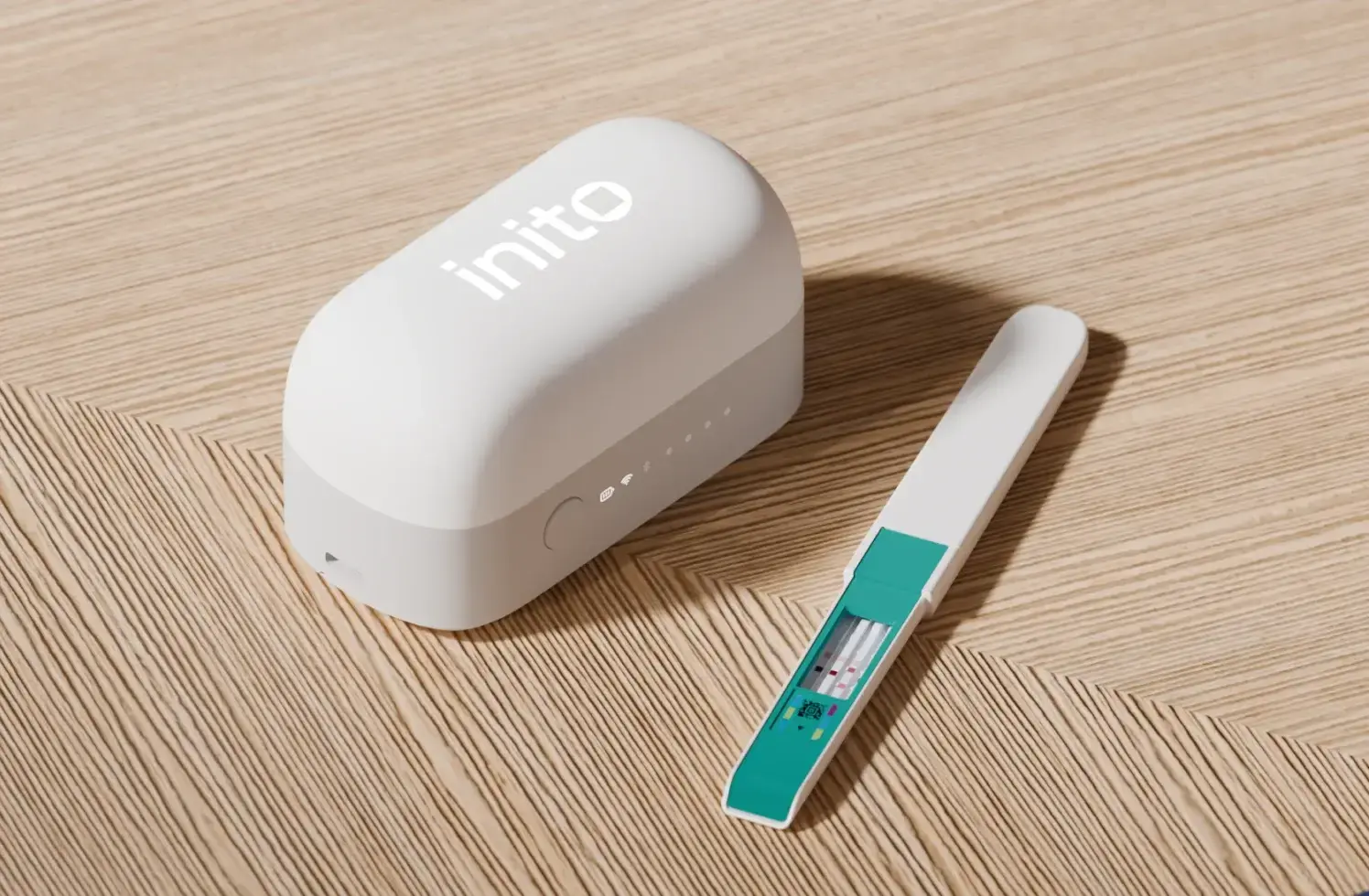 Inito Fertility Monitor's current wireless reader with a Fertility Strip