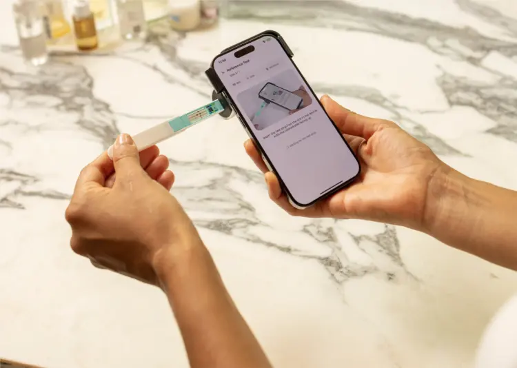 Insert the Fertility Strip into the Inito Fertility Tracker.